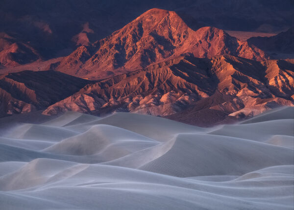 Glowing Mountains Blowing Sand
